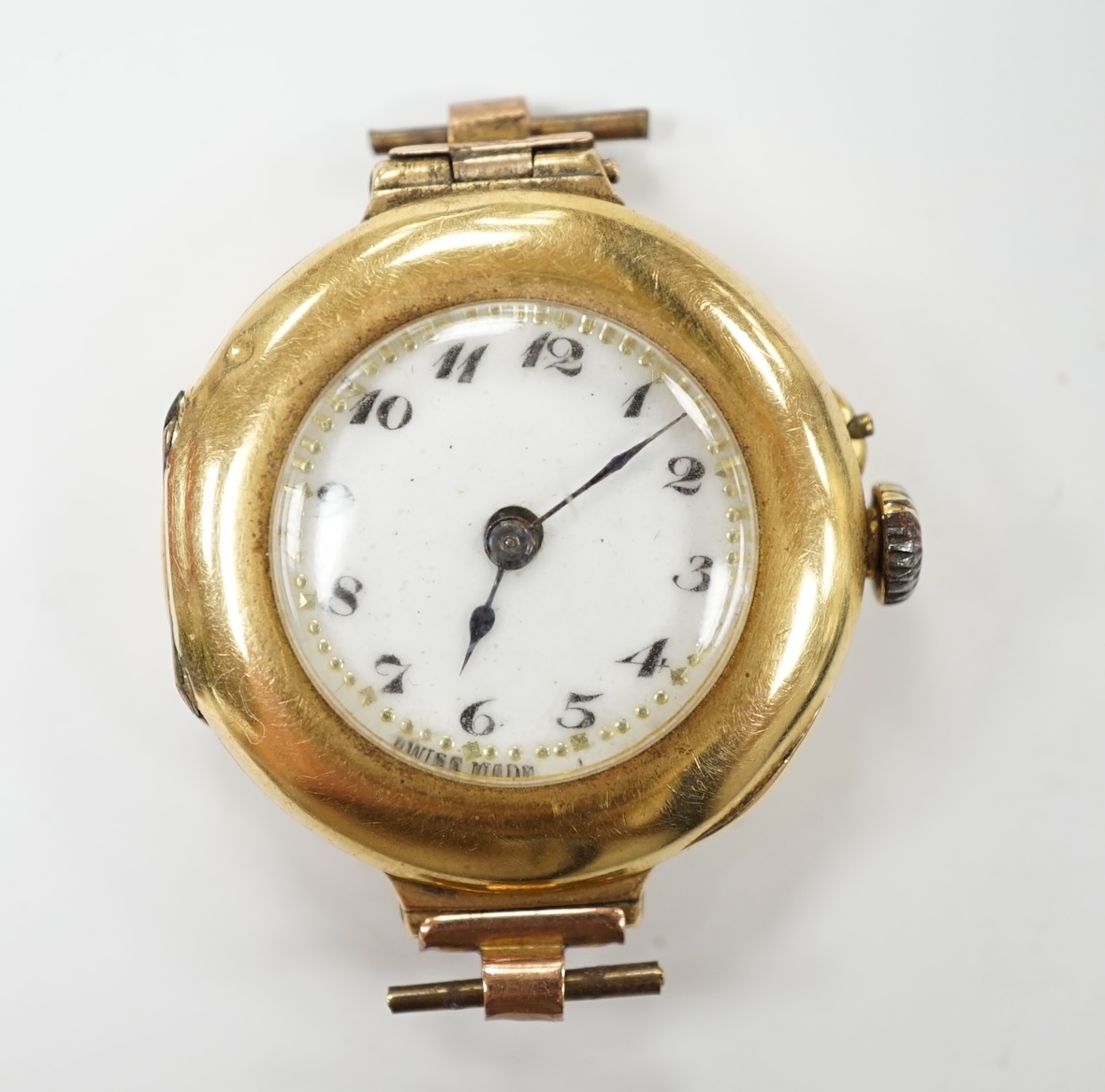 A lady's 18k manual wind wrist watch, with Arabic dial, no strap, gross weight 17.1 grams, Condition - poor